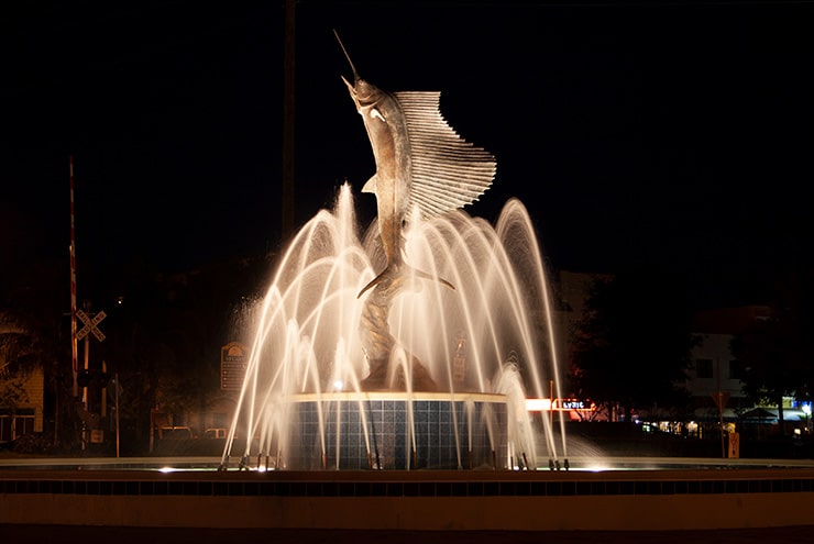 sailfish fountain in downtown stuart at night