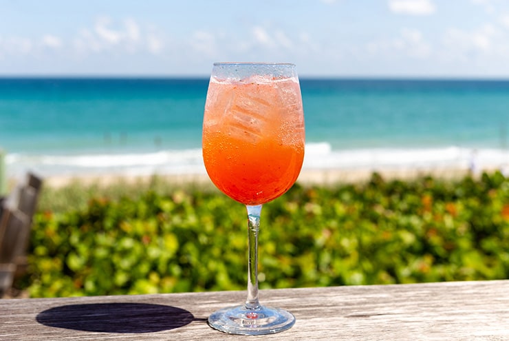 glass with drink on the beachfront of kyle gs